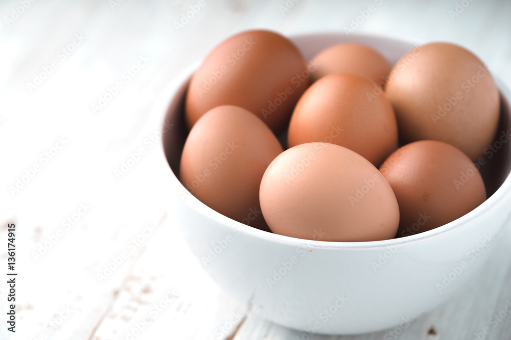 Chicken eggs in the ceramic bowl horizontal Chicken eggs in the ceramic bowl horizontal