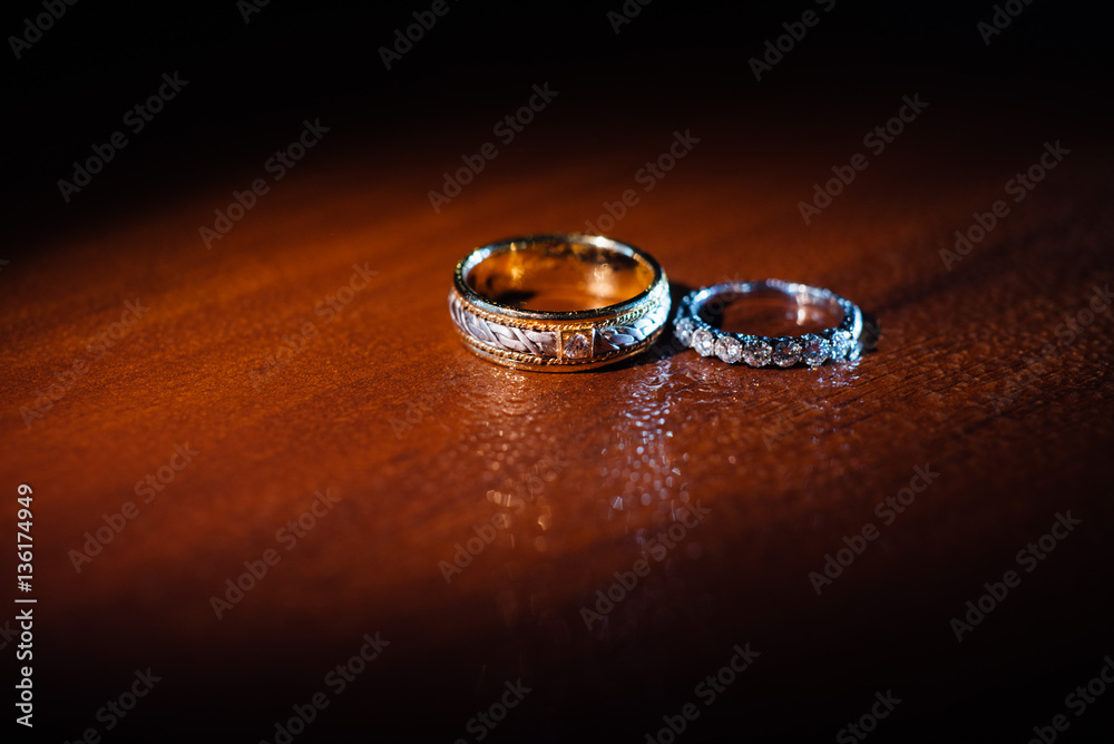 Wedding rings with water droplets against Wedding rings with water droplets against