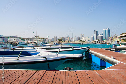 Quay with yachts and skyscrapers in Abu Dhabi, Saadiyat (Paradise) island, United Arabian Emirates (UAE) photo