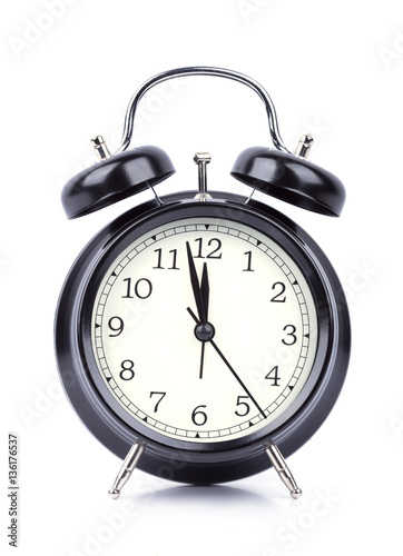 12 O' Clock on alarm clock isolated on white