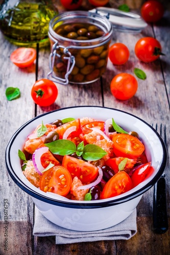 panzanella: Italian salad with tomatoes, ciabatta bread, olives, red onion and basil