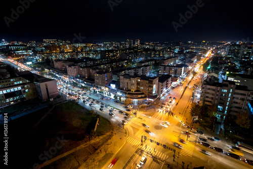Night view of the crossroad between Bill Clinton Boulevard and George W Bush Boulevard seen from the Mother Tereza Cathedral in Pristina, capital city of Kosovo. photo