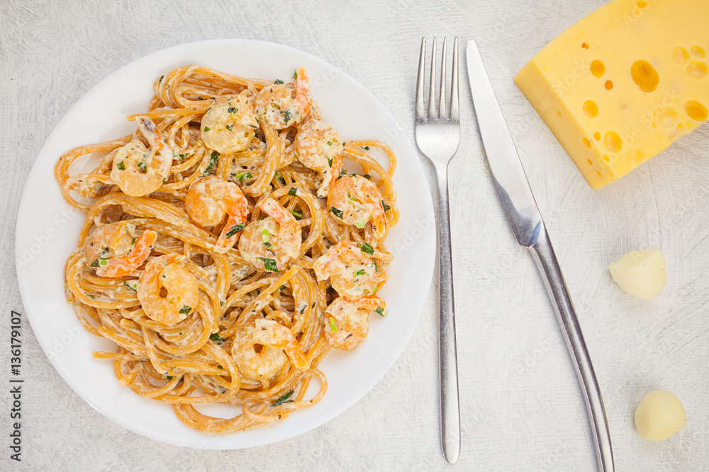 delicious delicious spaghetti with shrimps on wooden background delicious delicious spaghetti with shrimps on wooden background
