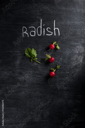 Radish over dark chalkboard background