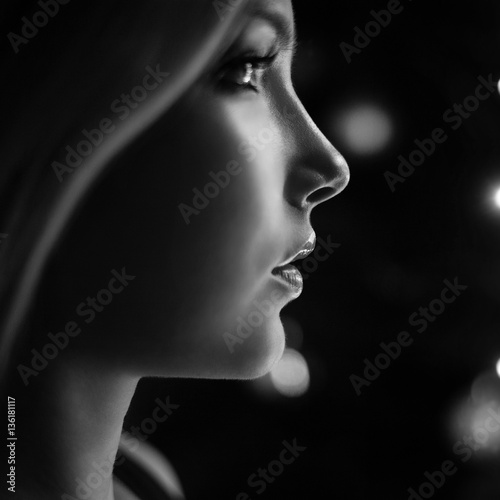 Beauty portrait of a sexy blonde with a magic lights