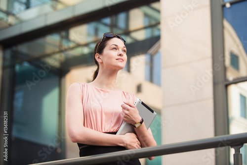 Business woman working with the tablet outdoors near the office Free Download Business woman working with the tablet outdoors near the office - GFXLoad