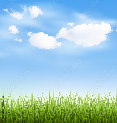 Grass lawn with clouds on blue sky