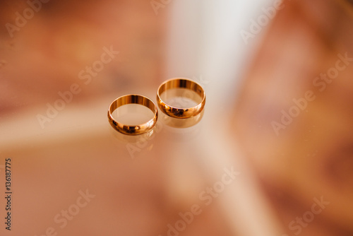 Wedding rings with water droplets against