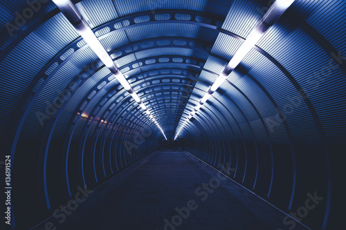 Modern city tunnel at night with lights