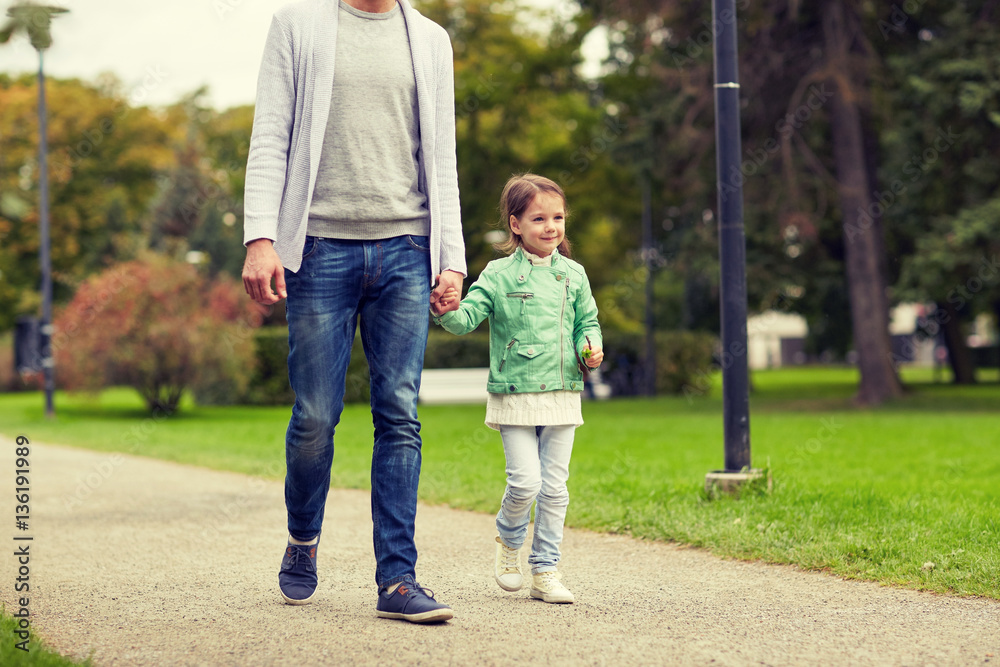 happy family walking in summer park