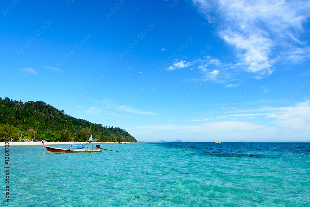 Wooden boats with clear water in koh Ngai, Trang, Thailand