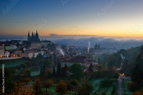 Amazing foggy morning near St. Vitus Cathedral and Lesser town, Prague, Czech republic.