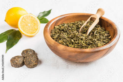 Tea with lemon and leaves in a rustic style