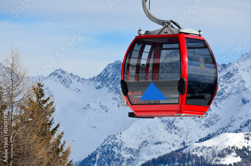 red cable car in the skiing resort in Alps