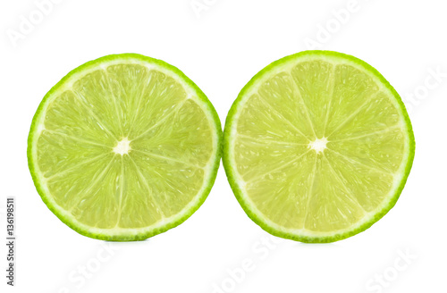 Ripe lime cut in half isolated over the white background