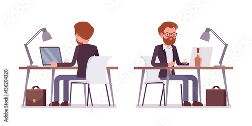 Young male manager working at the computer, rear and front view