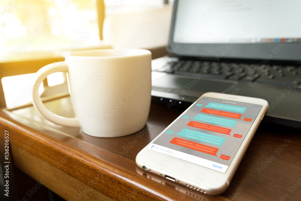 Chat bot , deep learning and future marketing concept . Chatbot application on mobile phone in coffee shop Chat bot , deep learning and future marketing concept . Chatbot application on mobile phone in coffee shop