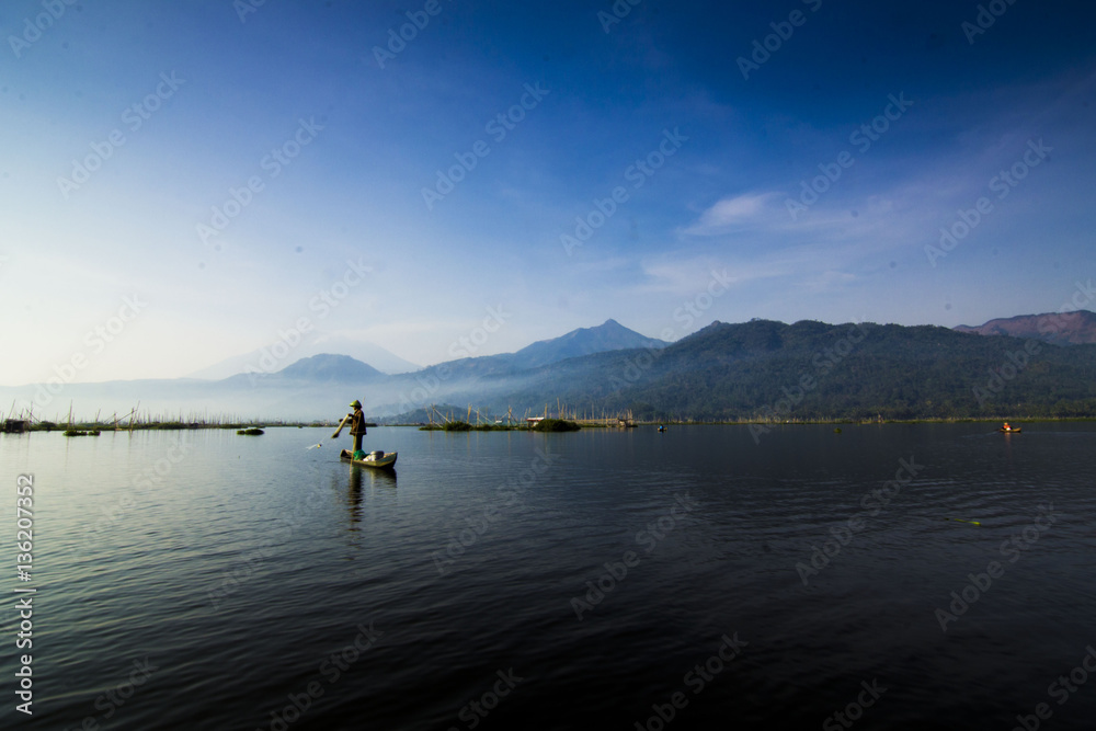Fisherman in lake