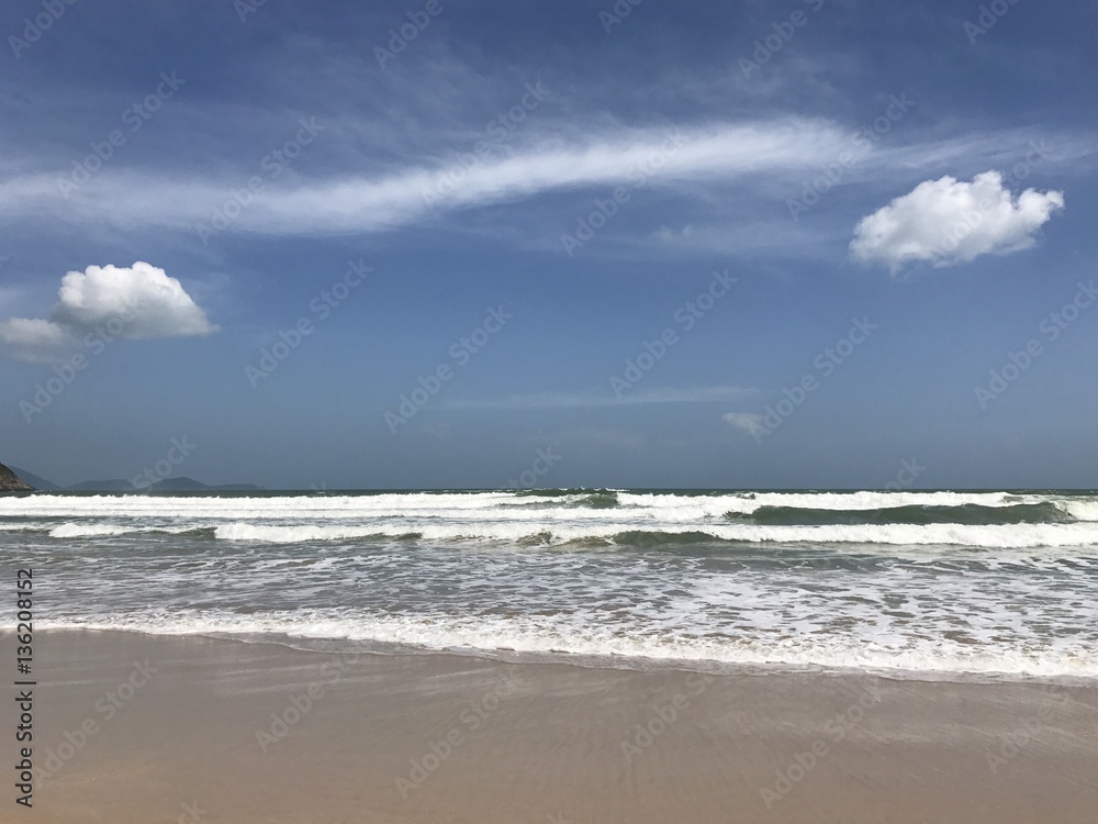 Two white clouds on blue sky, horizont , sea, coast, pair of clouds, vietnam