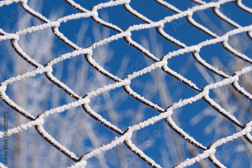 frozen metallic fence pattern