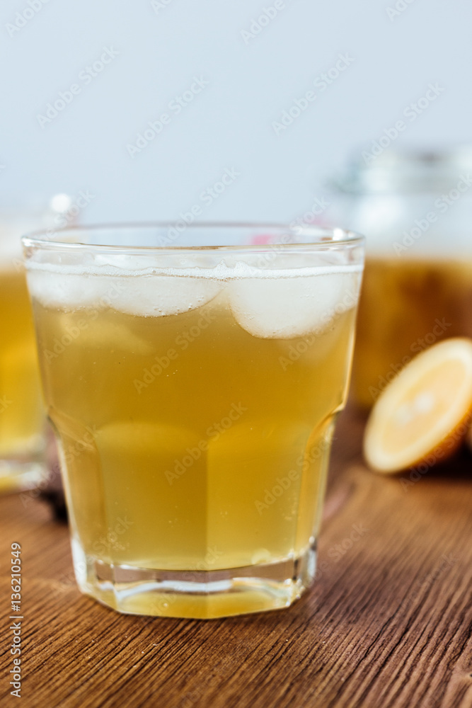 Ginger ale on wooden surface with ice in glass. Ginger ale on wooden surface with ice in glass.