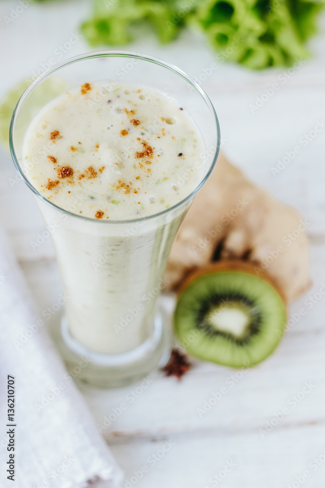 Fresh smothie - vegan drink with banana, salad leaves, ginger and kiwi. Fresh smothie - vegan drink with banana, salad leaves, ginger and kiwi.