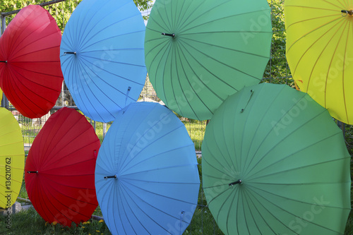 Decoration of colorful umbrellas on the wall. Celebration