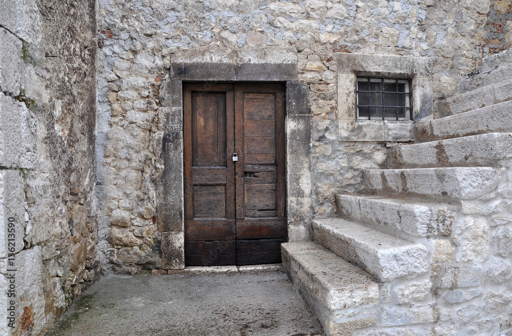 Old wooden door of an ancient building