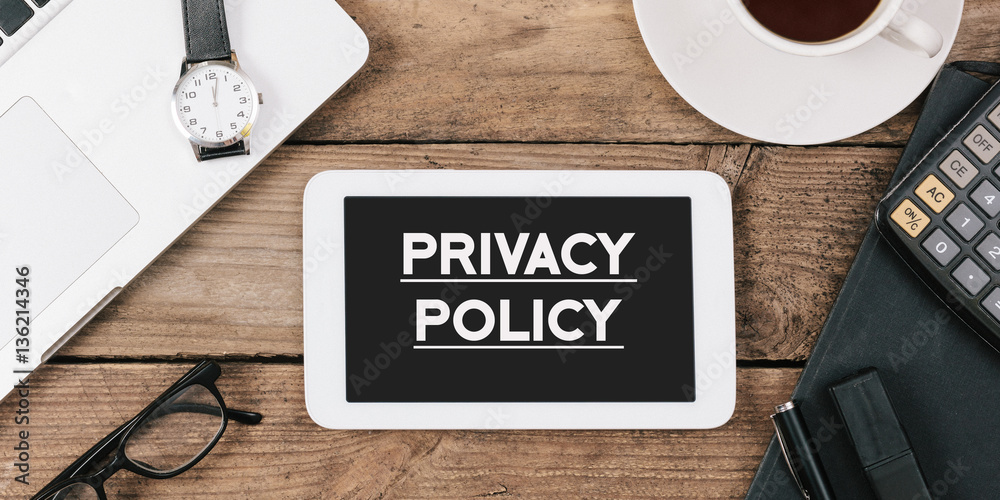 privacy policy on phone on Office desk with computer technology,