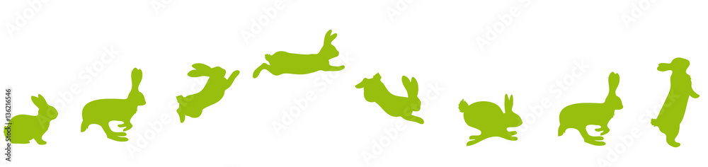 Fototapeta premium jumping Silhouettes of Easter bunnies green