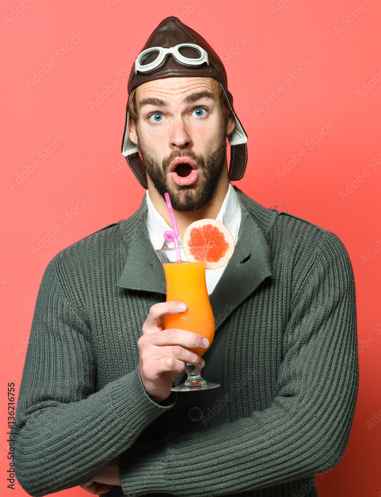 Fototapeta premium bearded pilot with cocktail in glass