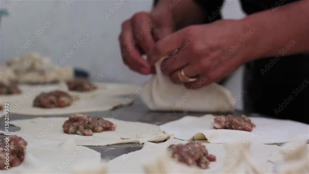 National Georgian cuisine Khinkali metal background Cook prepares khinkali kitchen Top view raw meat dough dish uncooked Street food booth selling Chinese specialty Steamed Dumplings Process cooking National Georgian cuisine Khinkali metal background Cook prepares khinkali kitchen Top view raw meat dough dish uncooked Street food booth selling Chinese specialty Steamed Dumplings Process cooking