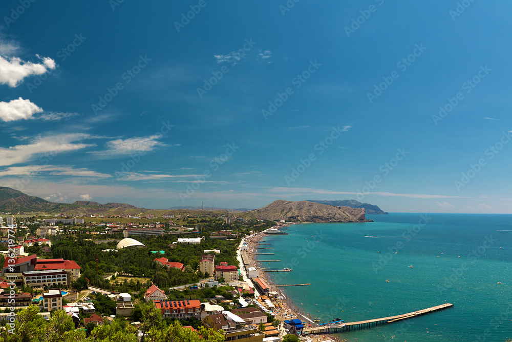 Panorama of the resort town of Sudak in the Crimea. Beautiful summer marine landscape. Travel photos