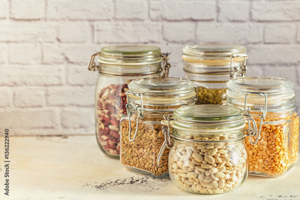 Glass jars with various legumes - beans, mung bean, peas and len Glass jars with various legumes - beans, mung bean, peas and len
