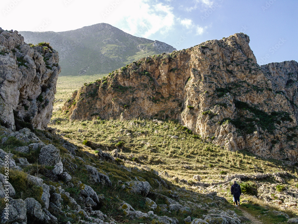 Woman hiking at Cofano, Sicily, Italy Woman hiking at Cofano, Sicily, Italy