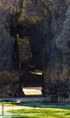 Natural arches on beach.