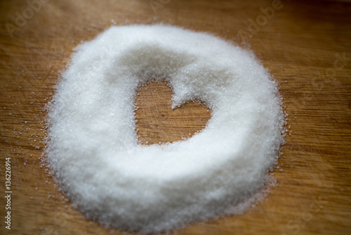 Sweet sugar heart on wooden background. Love and valentine day concept.