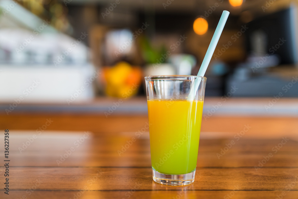 Fresh green and orange juice in a glass. Fresh green and orange juice in a glass.