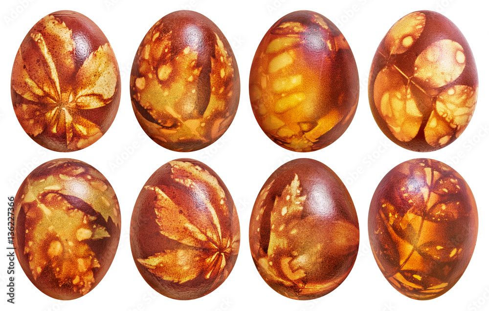 Collection of Eight Easter Eggs Red Dyed and Decorated with Leaves Imprints Isolated on White Background Collection of Eight Easter Eggs Red Dyed and Decorated with Leaves Imprints Isolated on White Background