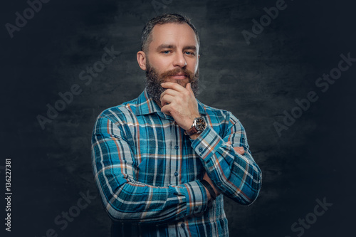 Middle age male in plaid shirt.