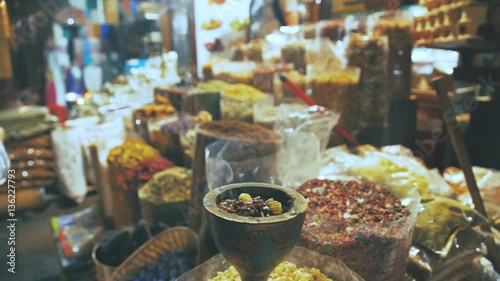 Wallpaper Mural Eastern Market with spices in Emirates. Close-up of spices in different colors on the market in the UAE. Hibiscus, curry, turmeric. Shop owner at spice market arranges display Torontodigital.ca