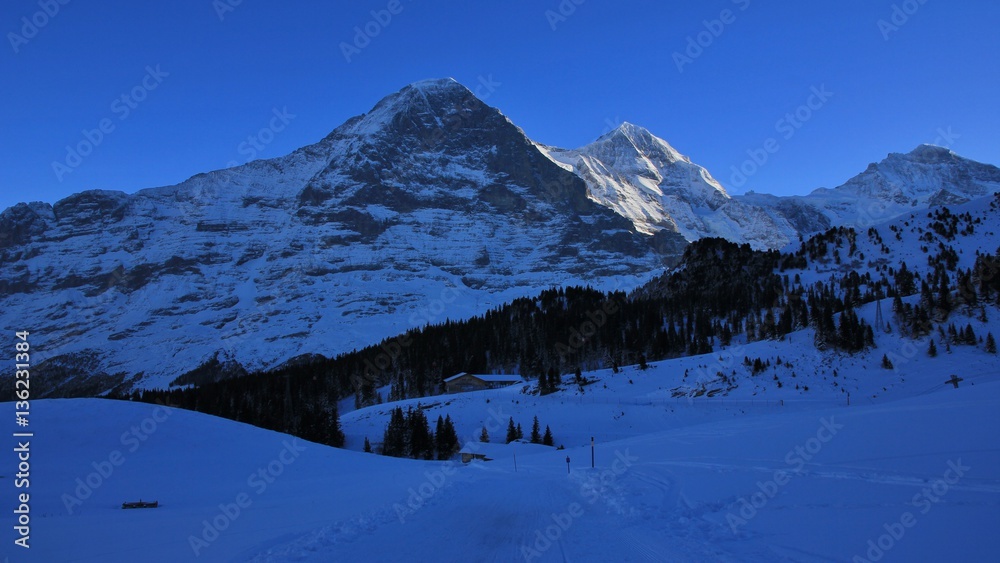 Eiger north face in winter.  Famous mountains Eiger, Monch and Jungfrau.


