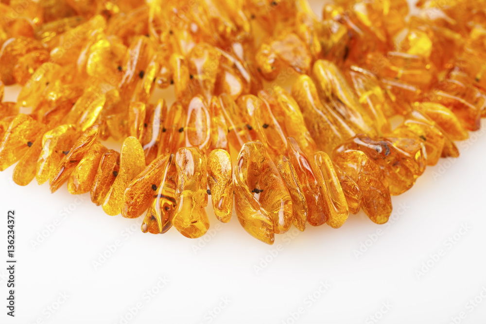 Fototapeta premium Amber necklace background texture