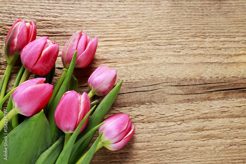 Fototapeta Naklejka Na Ścianę i Meble -  Beautiful pink tulips on wooden background.