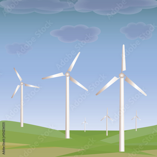 Green meadow with wind turbines generating electricity