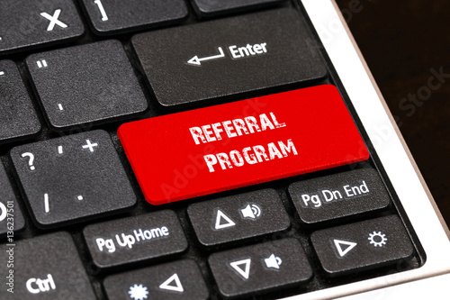 On the laptop keyboard the red button written Referral Program