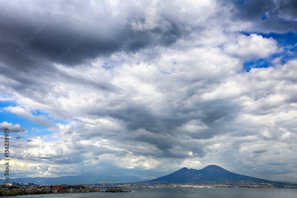 View of a mountain landscape and the sea horizon under the storm clouds View of a mountain landscape and the sea horizon under the storm clouds