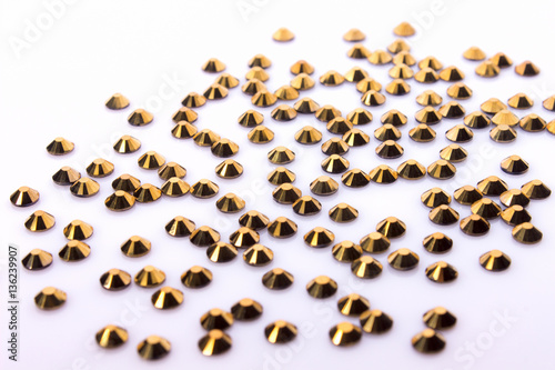 Gold Rhinestones on White Background Acrylic.