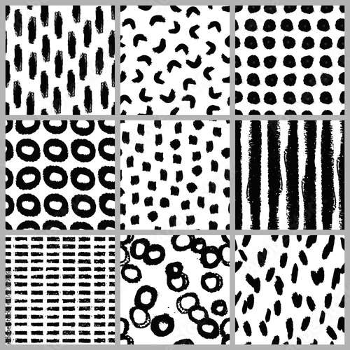 Set of nine hand drawn seamless patterns in black and white.