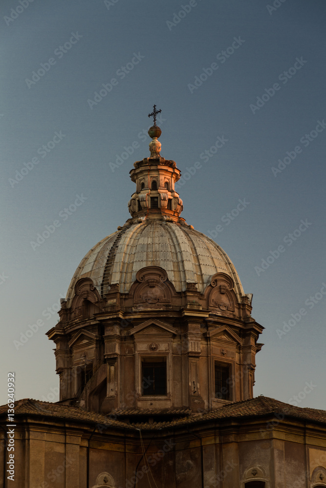 Church dome catching last light of day
